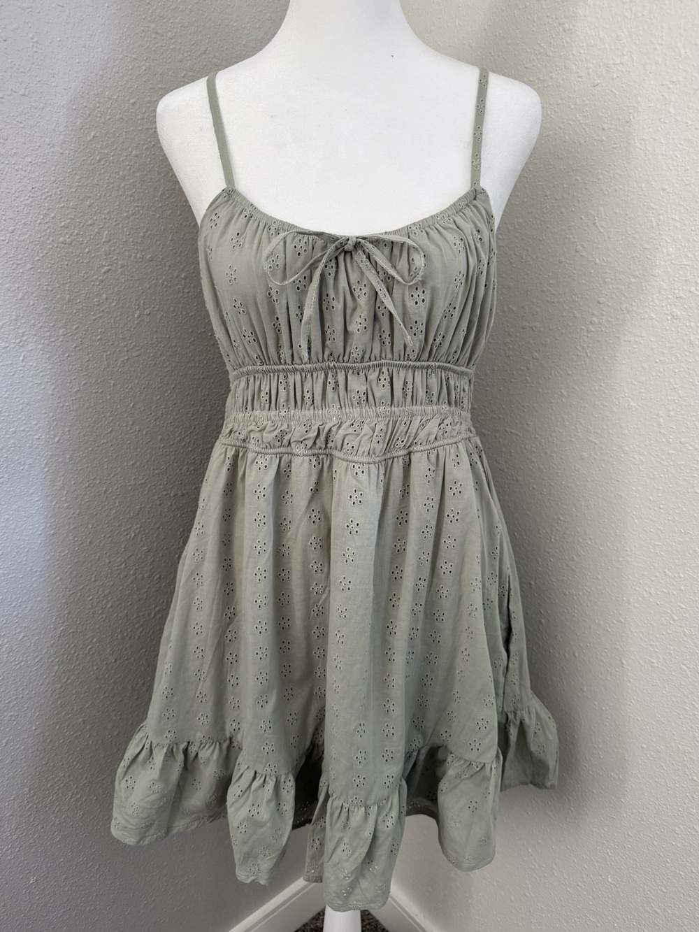 No Comment Sage Green Eyelet Smocked Mini Dress Tie Front Ruffle Hem Size L